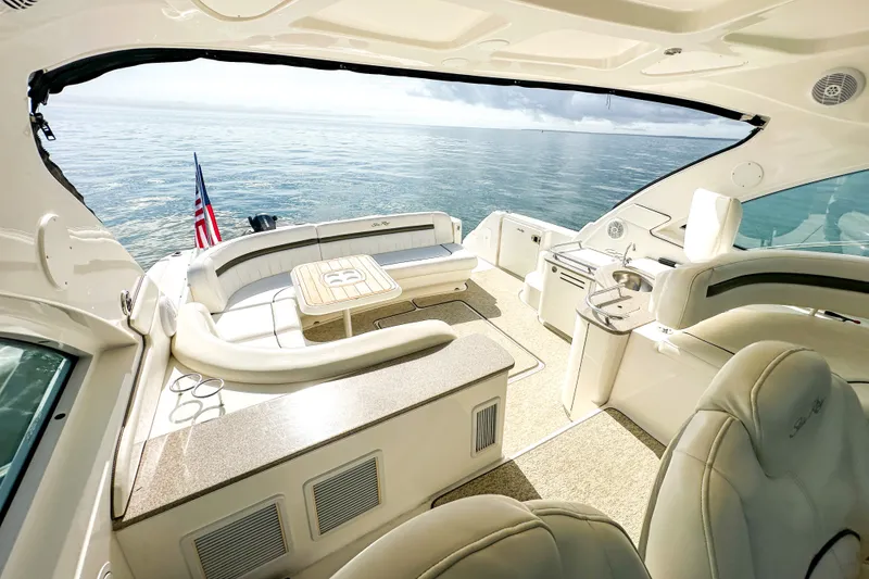 Slide: The Image of Luxurious 2006 Sea Ray 48 Sundancer yacht interior with ocean view and elegant seating. - 46