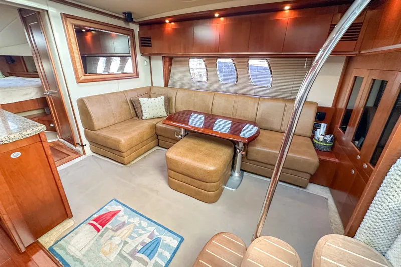 Slide: The Image of Luxurious interior of 2006 Sea Ray 48 Sundancer yacht with plush seating and elegant decor. - 67