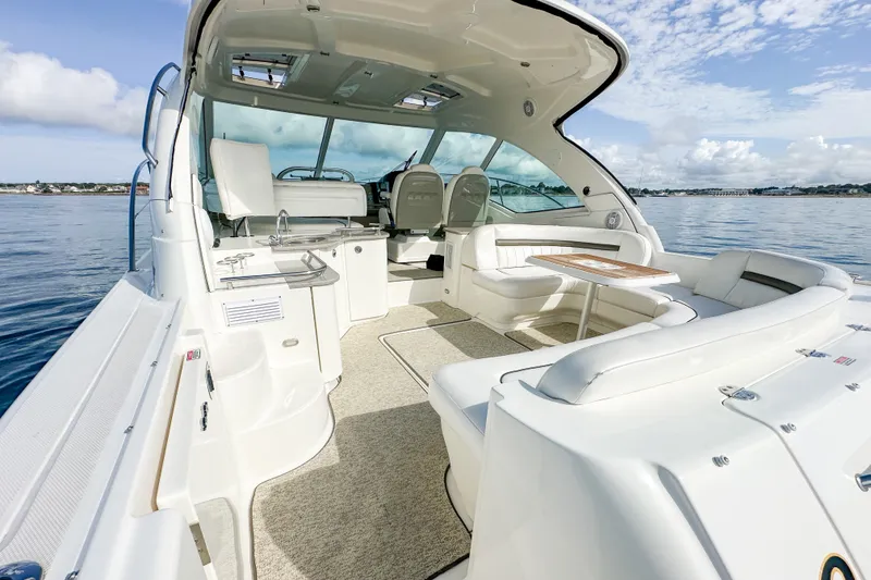 Slide: The Image of 2006 Sea Ray 48 Sundancer yacht interior with seating and ocean view. - 38