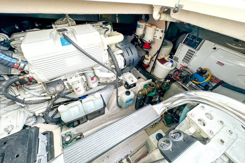 Slide: The Image of Engine room of a 2006 Sea Ray 48 Sundancer yacht, showcasing mechanical components. - 85