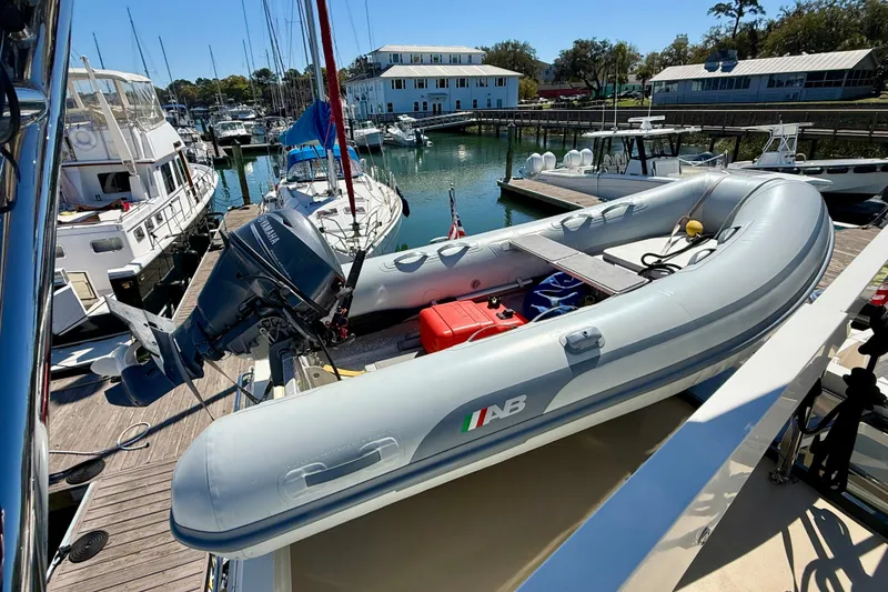 Slide: The Image of Inflatable boat with Yamaha motor on 2015 Coastal Craft 45 yacht at marina. - 35
