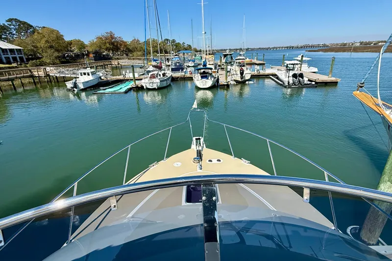 Slide: The Image of Bow view of 2015 Coastal Craft 45 yacht docked at a marina. - 27