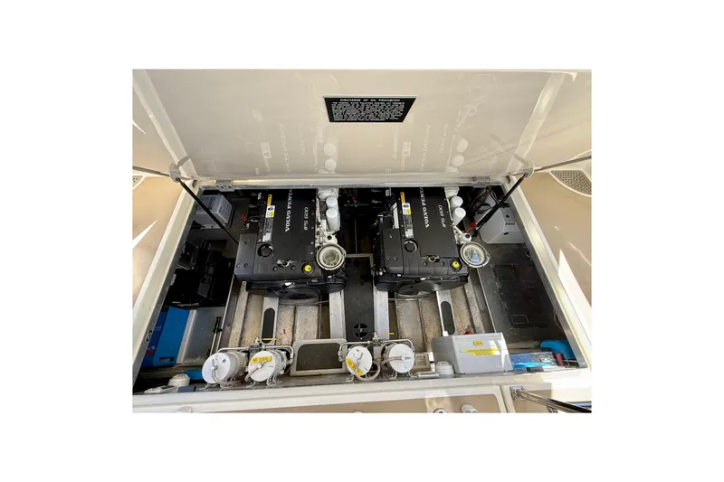 Slide: The Image of Engine compartment of a 2015 Coastal Craft 45 yacht, featuring Volvo Penta engines. - 69