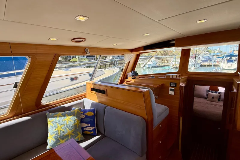 Slide: The Image of Luxurious interior of 2015 Coastal Craft 45 yacht with plush seating and elegant wood finishes. - 47