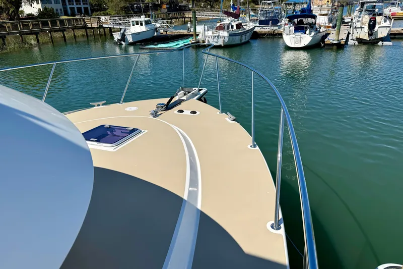 Slide: The Image of Bow view of 2015 Coastal Craft 45 yacht docked in a marina. - 20