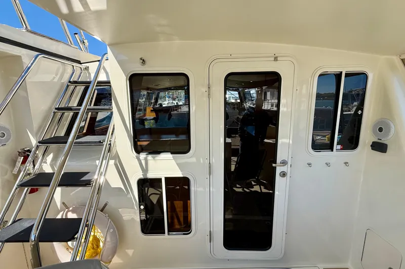 Slide: The Image of Coastal Craft 45 yacht, 2015 model, featuring sleek exterior with ladder and door. - 41