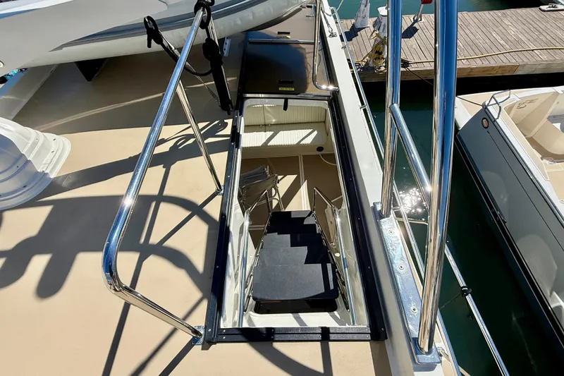 Slide: The Image of Stairway on 2015 Coastal Craft 45 yacht leading to lower deck, dockside view. - 36