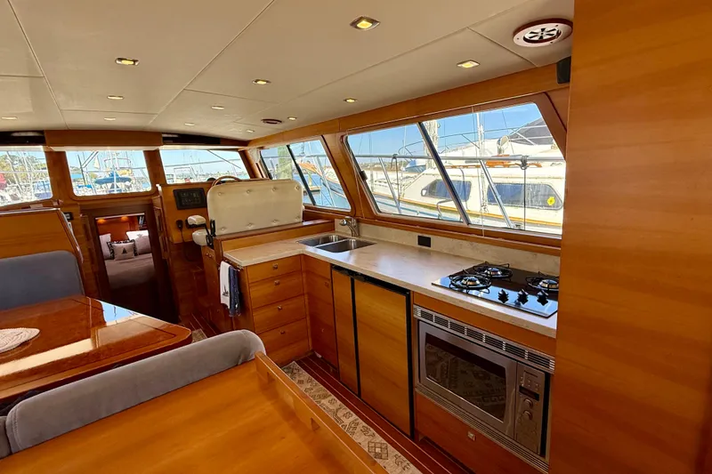 Slide: The Image of Luxurious interior of 2015 Coastal Craft 45 yacht with modern kitchen amenities. - 43