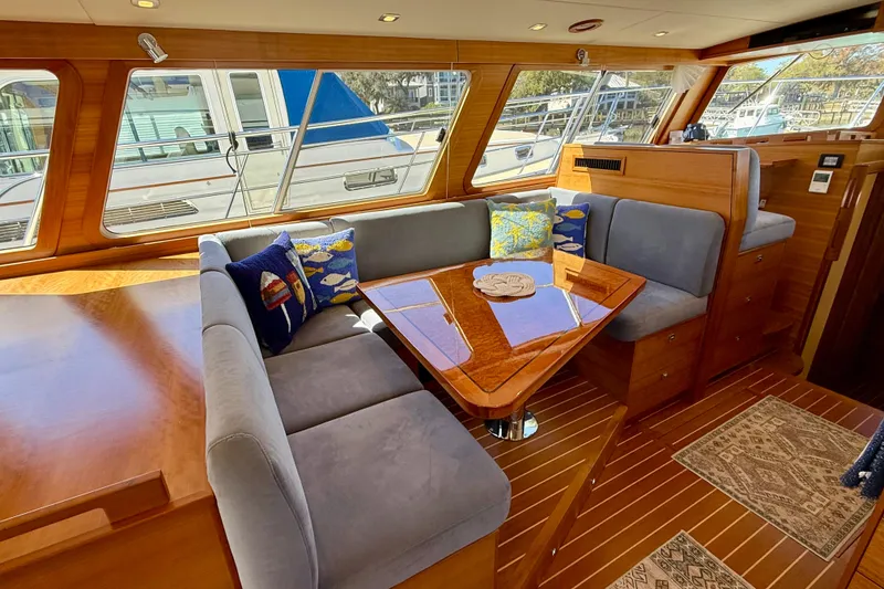 Slide: The Image of Luxurious interior of 2015 Coastal Craft 45 yacht with elegant wood finishes and plush seating. - 45