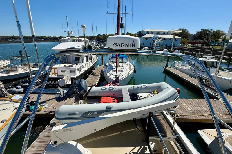 Slide: The Image of Coastal Craft 45 yacht docked at marina, featuring Garmin equipment, 2015 model. - 34