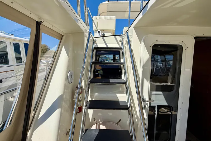 Slide: The Image of Stairway and door on 2015 Coastal Craft 45 yacht, showcasing sleek design and craftsmanship. - 37