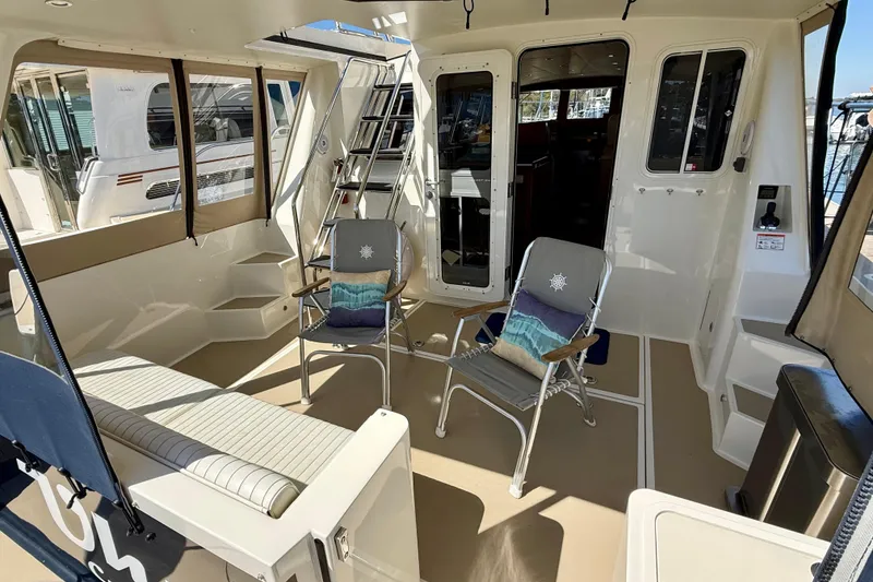 Slide: The Image of Spacious deck of 2015 Coastal Craft 45 yacht with seating and ladder access. - 38