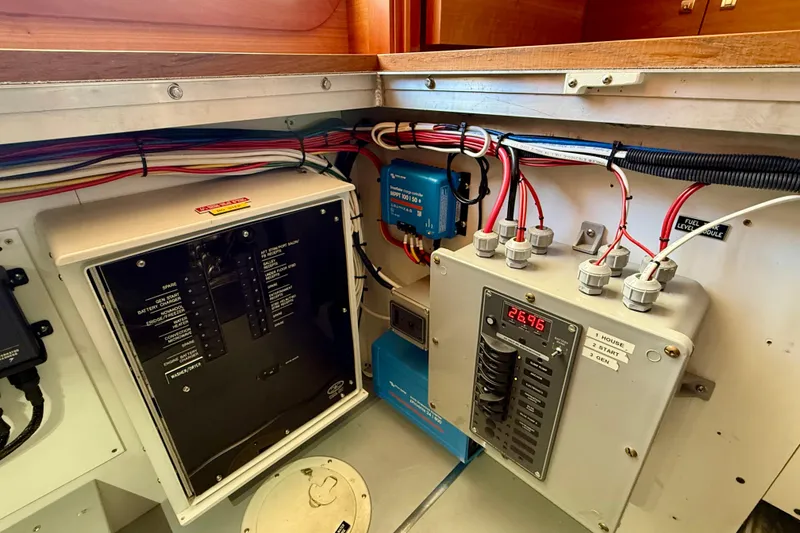 Slide: The Image of Electrical panel and wiring inside a 2015 Coastal Craft 45 boat. - 87