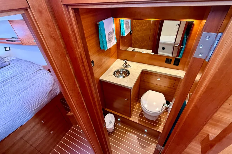 Slide: The Image of Luxurious 2015 Coastal Craft 45 yacht bathroom with wood accents and modern fixtures. - 57