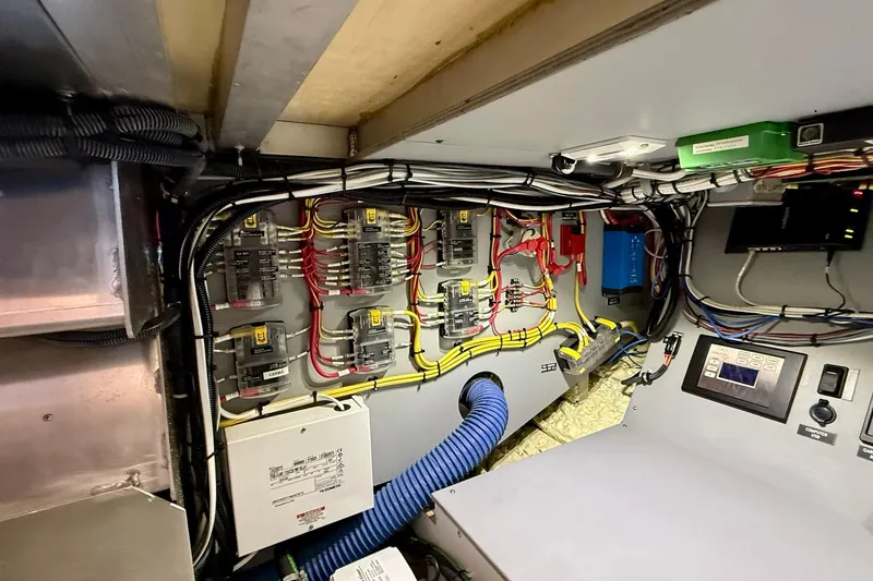Slide: The Image of Electrical panel and wiring inside a 2015 Coastal Craft 45 boat. - 81