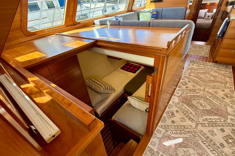 Slide: The Image of Luxurious interior of 2015 Coastal Craft 45 yacht with cozy seating and elegant wood finish. - 65