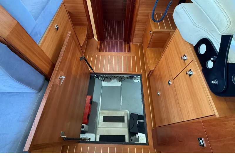 Slide: The Image of Interior of 2015 Coastal Craft 45 yacht with wooden cabinetry and seating. - 77