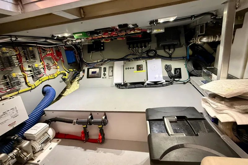 Slide: The Image of Engine room of a 2015 Coastal Craft 45 yacht, showcasing electrical systems and wiring. - 80
