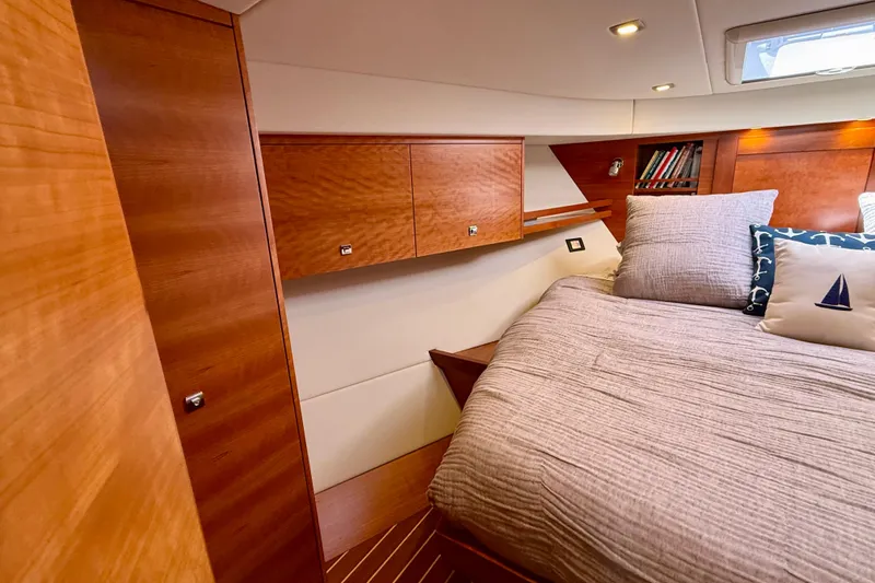 Slide: The Image of Luxurious cabin interior of 2015 Coastal Craft 45 yacht with wooden finishes and cozy bedding. - 60