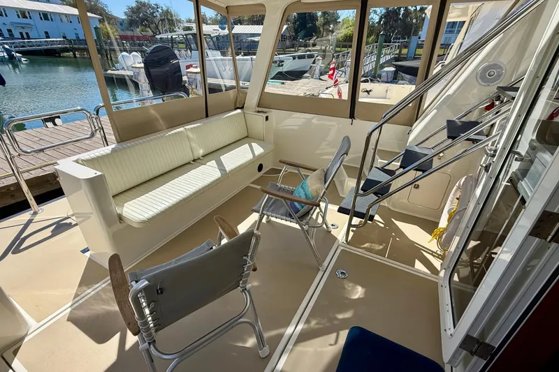 Slide: The Image of Spacious interior of 2015 Coastal Craft 45 yacht with seating and dock view. - 39