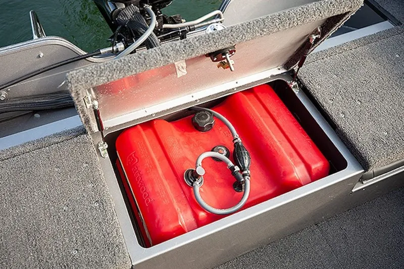 Slide: The Image of Red fuel tank in 2027 Lowe Fishing Machine 1625SC storage compartment. - 4