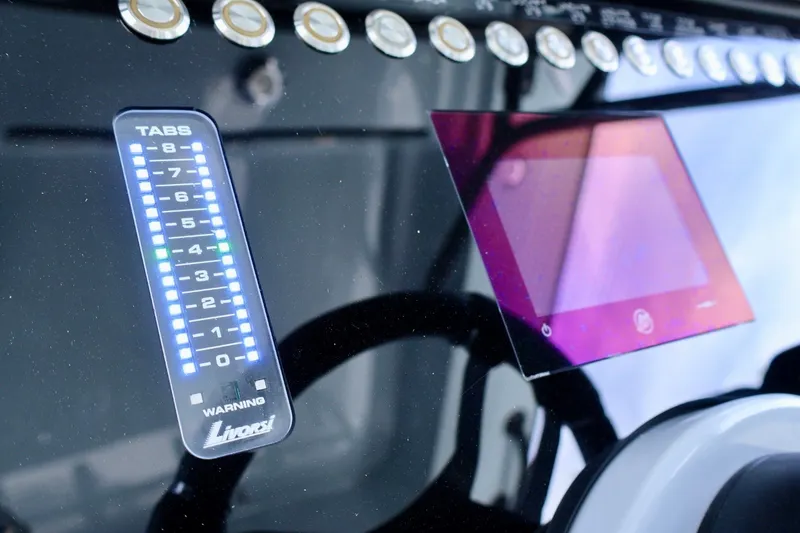Slide: The Image of 2023 Fountain 34 Tournament Edition dashboard with digital display and control panel. - 18