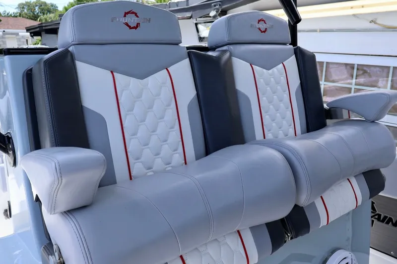 Slide: The Image of 2023 Fountain 34 Tournament Edition boat seats with stylish gray and white upholstery. - 6