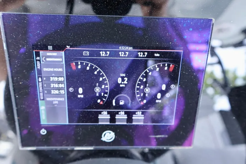 Slide: The Image of Digital dashboard of 2023 Fountain 34 Tournament Edition boat displaying engine metrics. - 19
