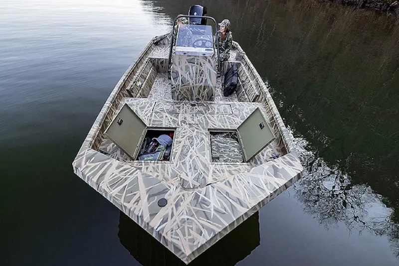 Slide: The Image of 2027 Lowe Roughneck RX1760 Pathfinder boat with camouflage design on calm water. - 5