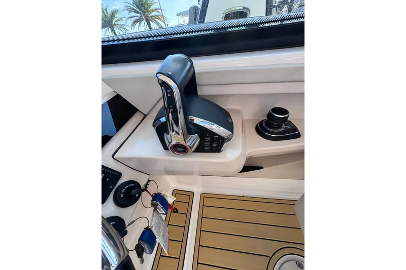 Slide: The Image of Control panel of 2022 Boston Whaler 280 Vantage boat with joystick and throttle. - 27
