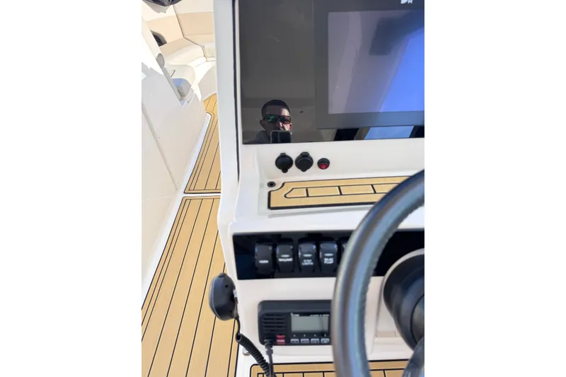 Slide: The Image of 2022 Boston Whaler 280 Vantage helm with modern controls and sleek design. - 24