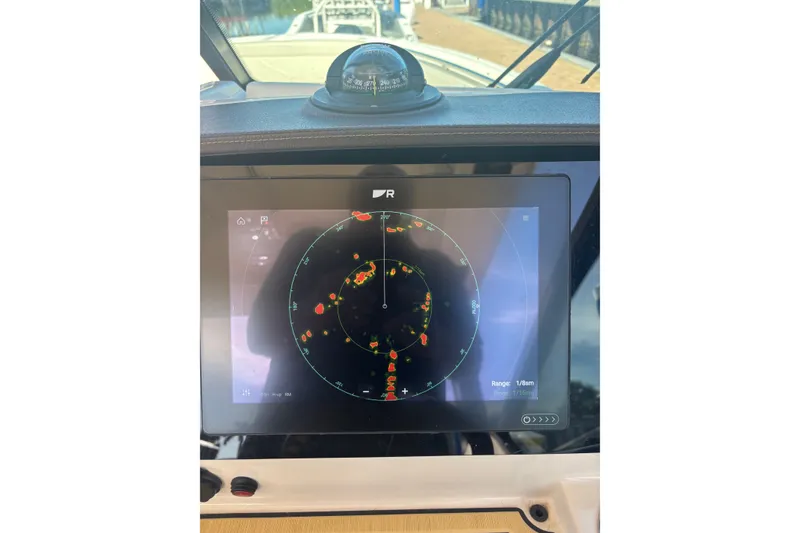 Slide: The Image of Radar display on 2022 Boston Whaler 280 Vantage boat dashboard. - 25