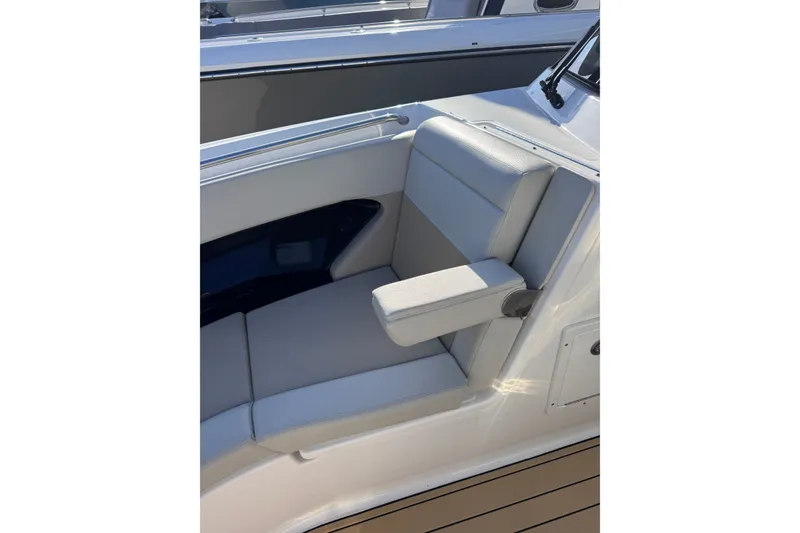Slide: The Image of 2022 Boston Whaler 280 Vantage boat seat with armrest, showcasing luxury design. - 22