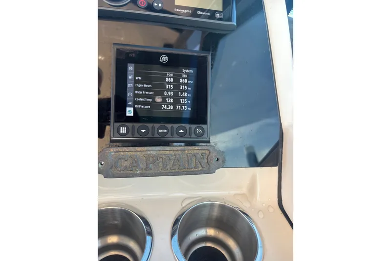 Slide: The Image of Dashboard of a 2022 Boston Whaler 280 Vantage boat showing engine metrics. - 31