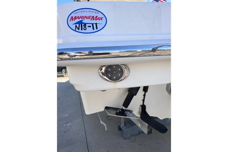 Slide: The Image of 2022 Boston Whaler 280 Vantage boat stern with MarineMax logo and underwater light. - 44