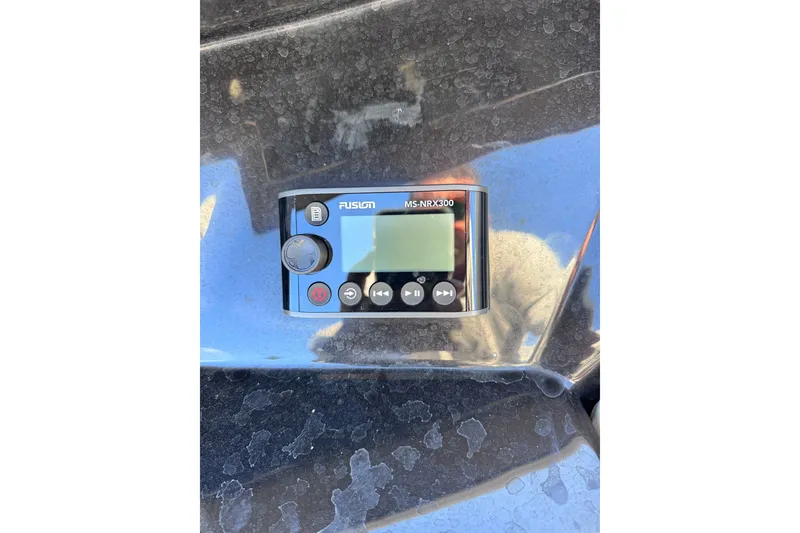 Slide: The Image of Fusion MS-NRX300 marine stereo on 2022 Boston Whaler 280 Vantage boat dashboard. - 32