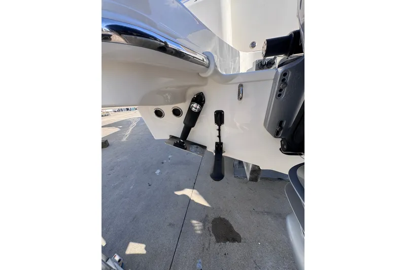Slide: The Image of 2022 Boston Whaler 280 Vantage boat stern detail with trim tabs and fittings. - 37