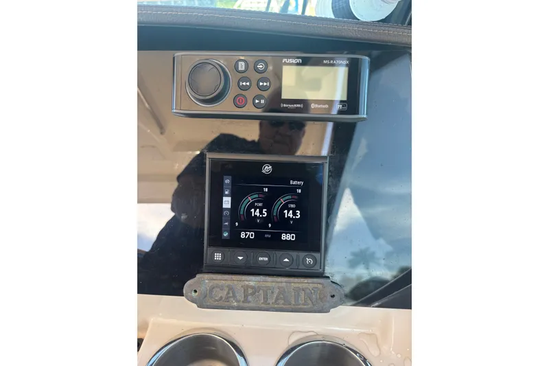 Slide: The Image of Control panel of a 2022 Boston Whaler 280 Vantage boat with digital displays. - 30