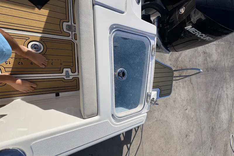 Slide: The Image of Boston Whaler 280 Vantage 2022 boat deck with livewell and Mercury engine. - 16
