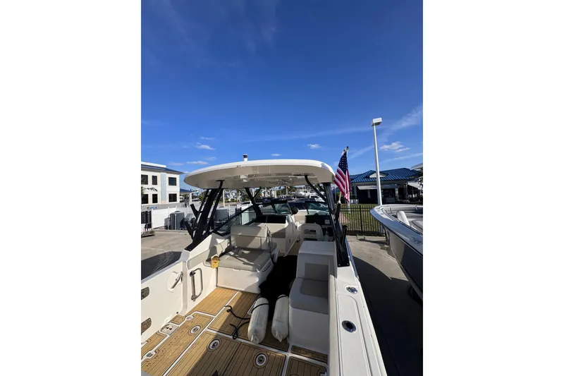 Slide: The Image of 2022 Boston Whaler 280 Vantage boat docked under clear blue sky. - 41
