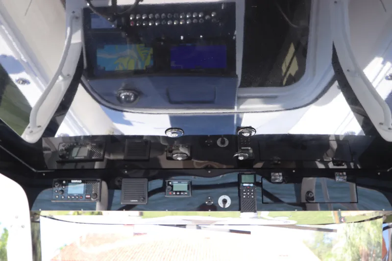 Slide: The Image of Interior dashboard of a 2021 Edgewater 370CC boat with navigation equipment. - 37