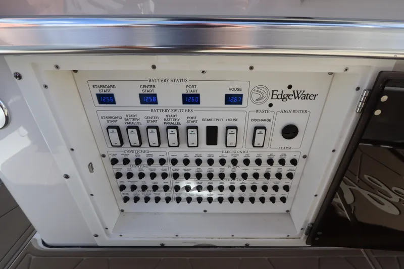 Slide: The Image of Edgewater 370CC 2021 control panel displaying battery status and switches. - 62