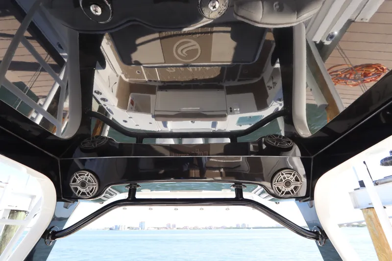 Slide: The Image of Interior view of a 2021 Edgewater 370CC boat, showcasing sleek design and audio system. - 26