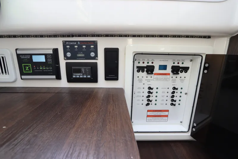 Slide: The Image of Control panel of a 2021 Edgewater 370CC boat with various electronic systems. - 60