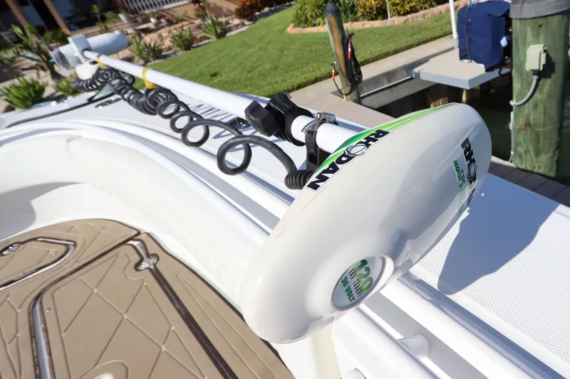 Slide: The Image of Edgewater 370CC 2021 boat with a mounted trolling motor on deck. - 45