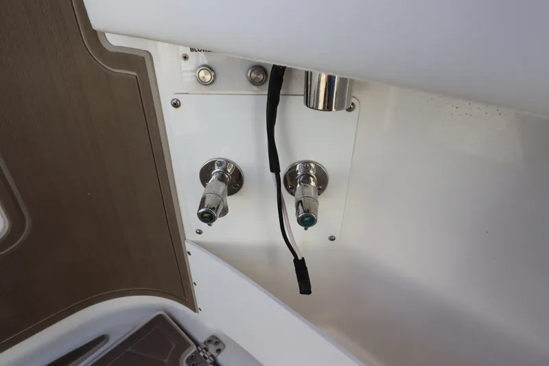 Slide: The Image of Edgewater 370CC 2021 boat control panel with switches and wiring. - 16