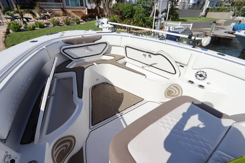 Slide: The Image of 2021 Edgewater 370CC boat interior with seating and storage compartments. - 41