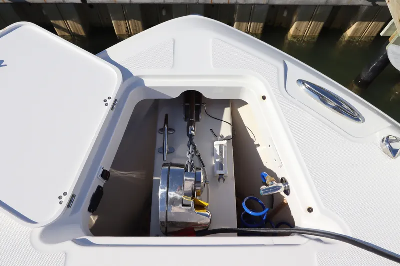 Slide: The Image of Anchor compartment of 2021 Edgewater 370CC boat, featuring storage and equipment. - 46