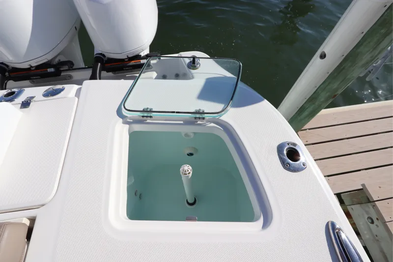 Slide: The Image of Livewell on 2021 Edgewater 370CC boat, open lid, dockside view. - 15