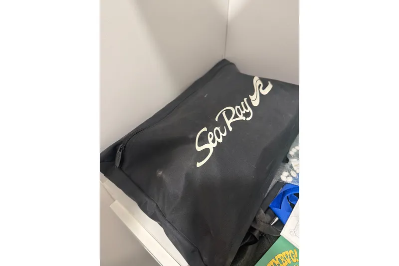 Slide: The Image of Black Sea Ray bag on shelf, associated with 2004 Sea Ray 180 Sport boat. - 5